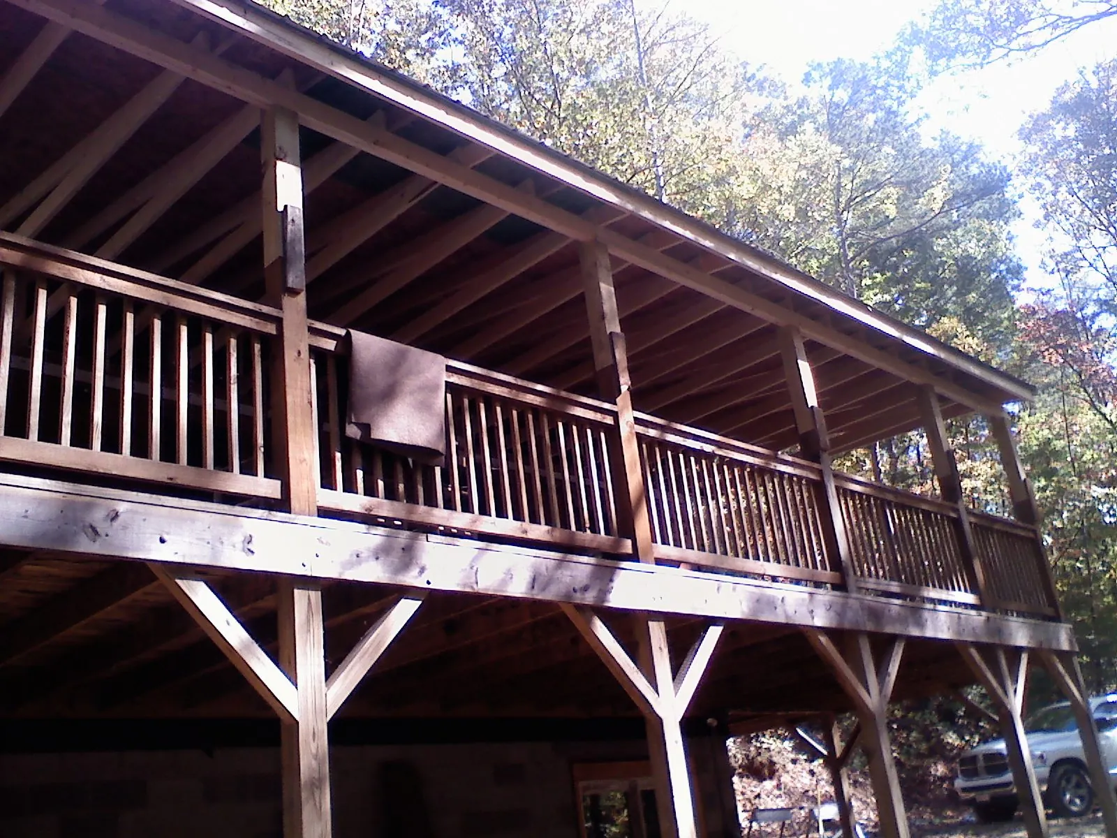 Timber framing under a new elevated porch and deck — Roof Leak Repair in Cogswell by Roofing Brothers